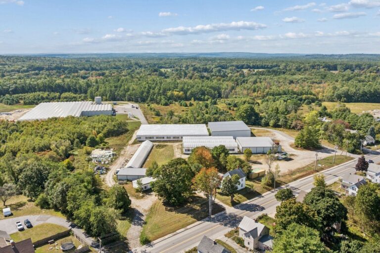 Aerial view of greenhouse buildings and adjoining headhouses in Lisbon, Maine