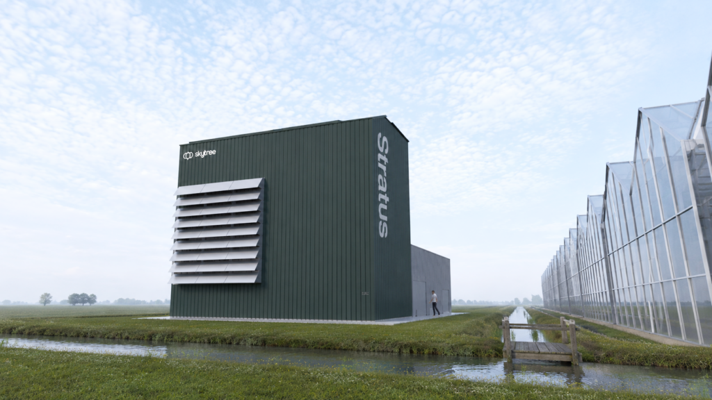 Skytree Stratus direct-air-capture industrial unit next to a canal and greenhouses in the Netherlands