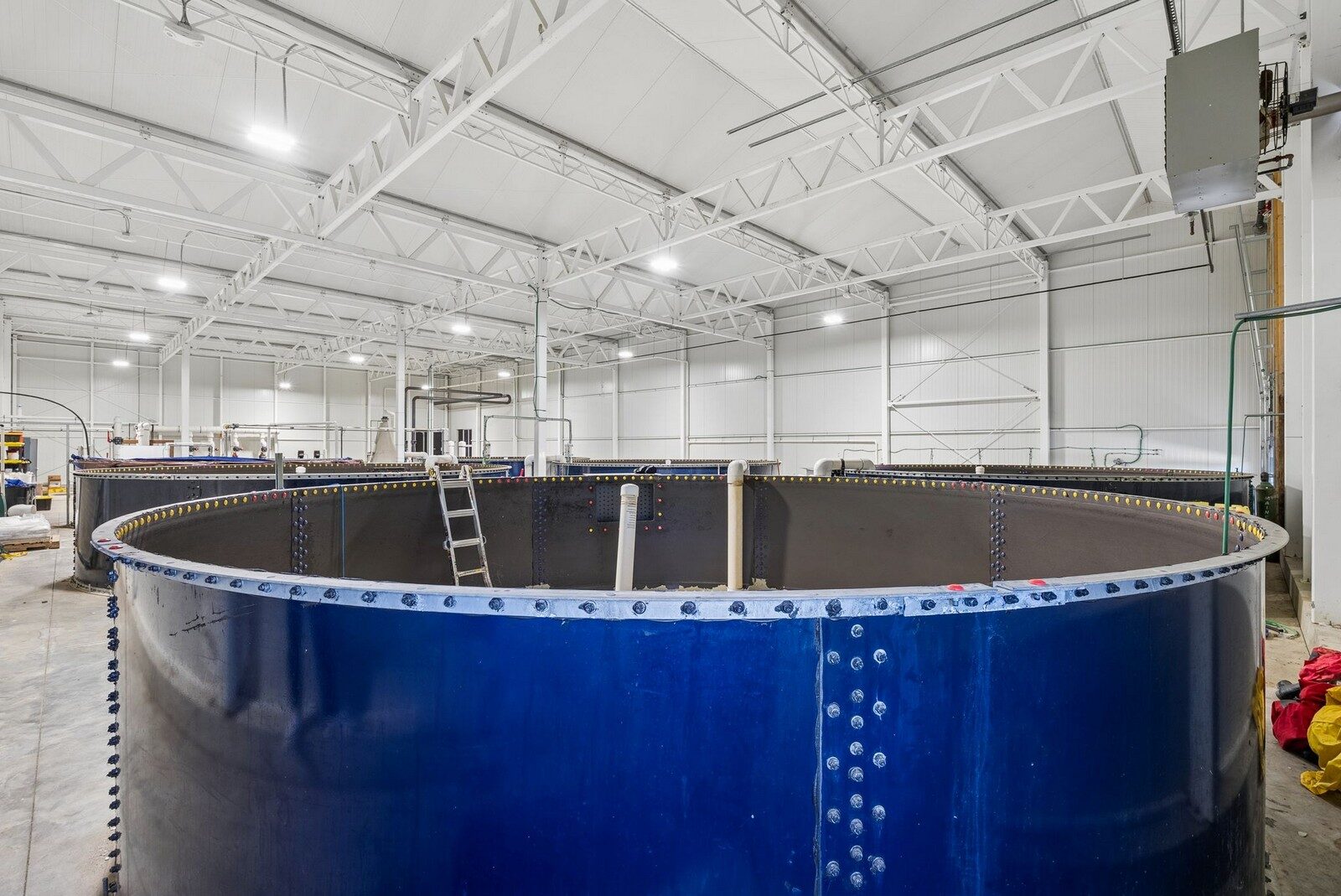 Large circular tanks and pipework inside a headhouse