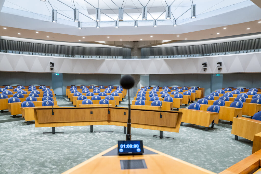 Empty Dutch House of Representatives plenary chamber at its temporary location